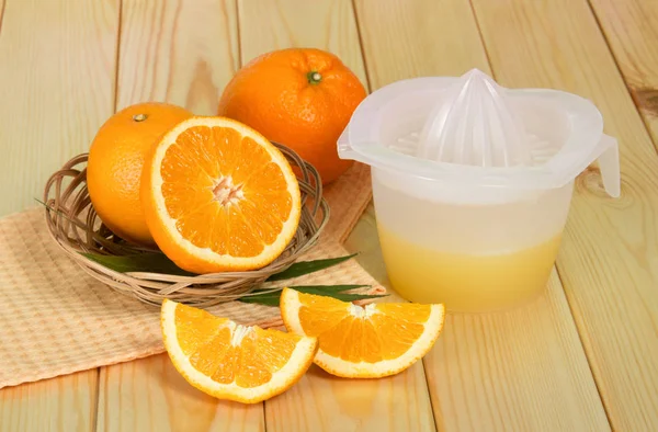 Oranges, juice press on the table — Stock Photo, Image