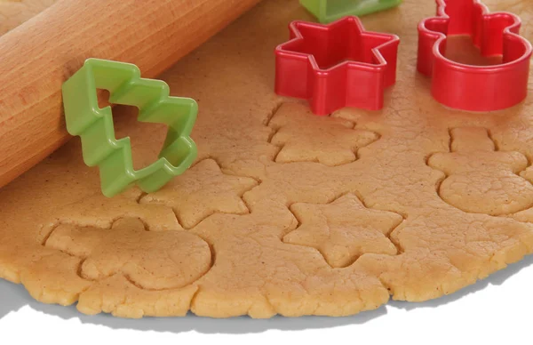 Ein Stück Teig mit geformtem Keks und Nudelholz — Stockfoto