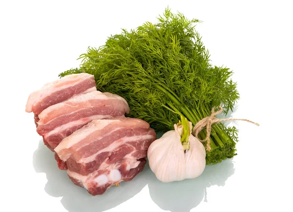 Pieces of pork brisket, garlic and bunch of dill isolated — Stock Photo, Image