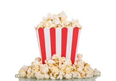 Large square box filled with mountain popcorn and around on whit