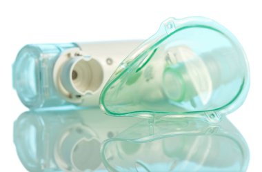 Compact electronic mesh inhaler and mask on blue background