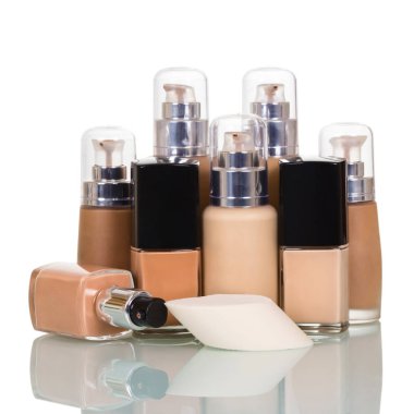 Bottles with foundation of different tones, one open 