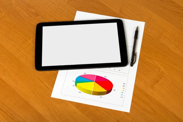 Tablet, pen and sheet of paper with graph on the desktop — Stockfoto