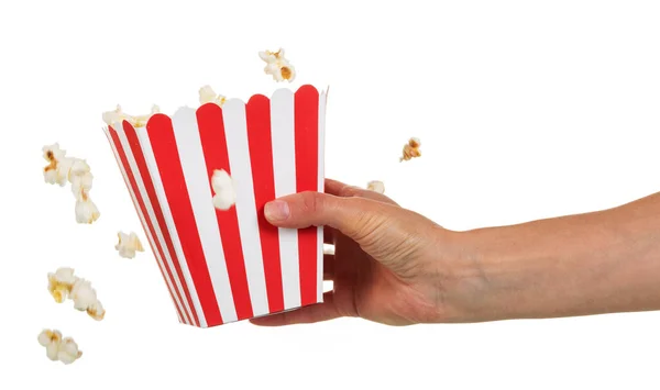 Female hand holding large square box popcorn on white. — Stock Photo, Image
