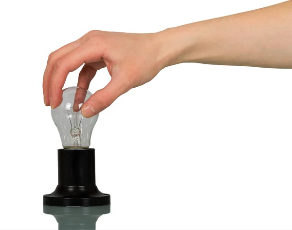 In una mano femminile una lampada ad incandescenza con cartuccia isolata — Foto Stock