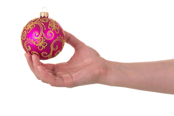 Roze Kerst Speelgoed Vrouwelijke Hand Geïsoleerd Witte Achtergrond — Stockfoto