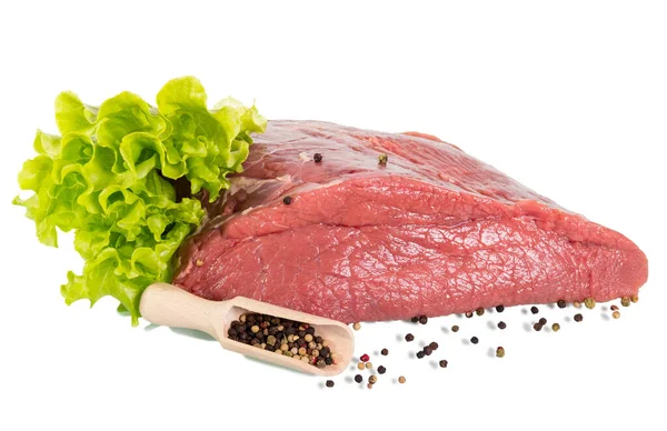 A large piece of raw beef, scoop with different pepper and lettu — Stock Photo, Image