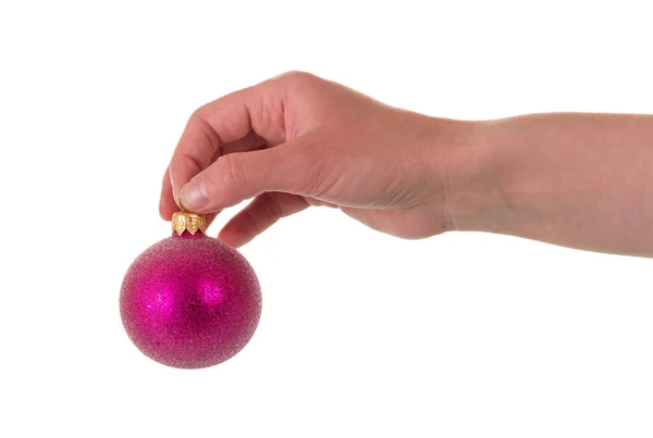 Weibliche Hand Hält Rosa Spielzeugball Für Neujahr Isoliert Auf Weißem — Stockfoto