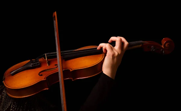 Violin in the hands of musician, isolated on black — Stock Photo, Image