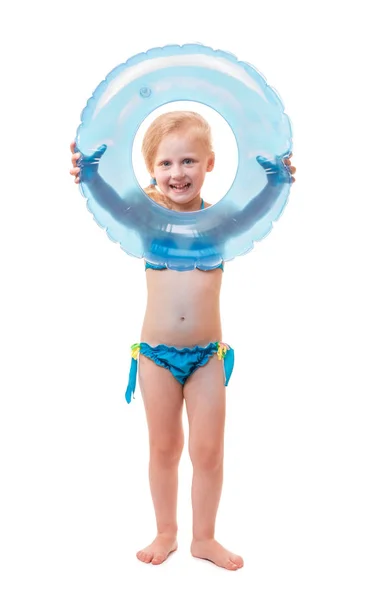 Happy baby girl in swimsuit with circle isolated on white Stock Photo