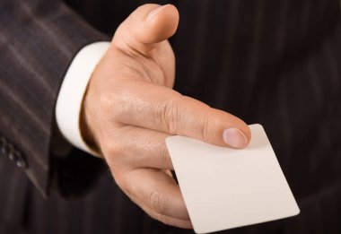 Business card in the hands of men