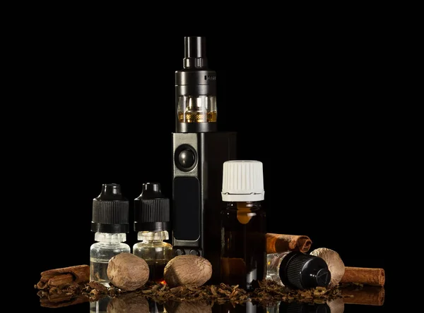 Electronic cigarette bottles with the liquid and spices for odor — Stockfoto