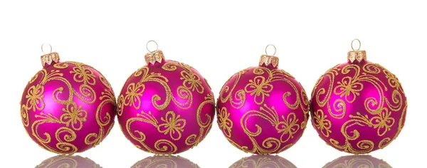 Ornate pink Christmas balls with pattern standing side by side — 图库照片