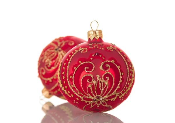 Bright red Christmas toy ball decorated with gold pattern isolated on white — Stockfoto