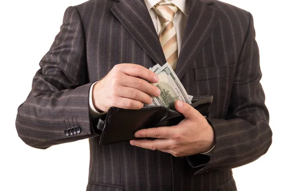 Successful businessman takes money from the wallet, isolated on white — Stock Photo, Image