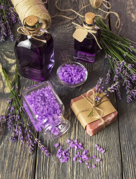 Bottles with lavender infusion closed with cork, soap and sea salt, close-up — Stock Photo, Image