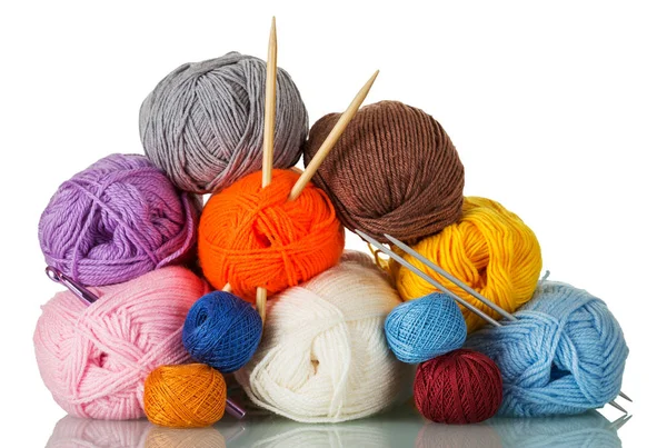 Skeins of yarn of different colors, shapes, quality, and two pairs of knitting needles isolated on white — ストック写真