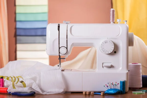 Sewing machine and fabric in work, near sewing accessories — Stock Photo, Image