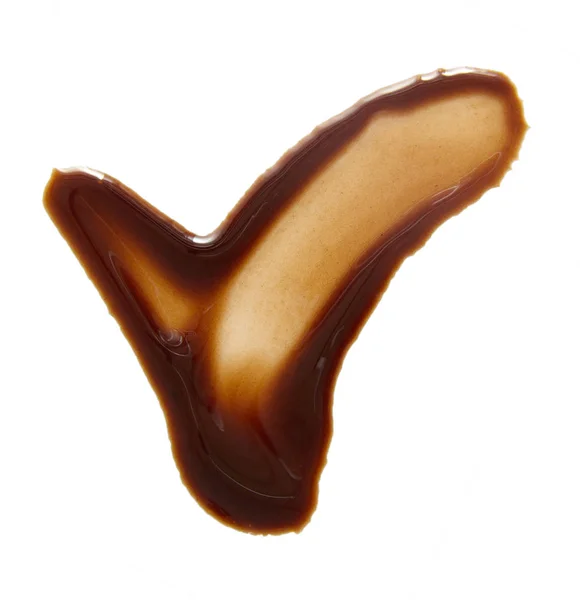 Dabs and drops of melted chocolate isolated on white — Stock Photo, Image