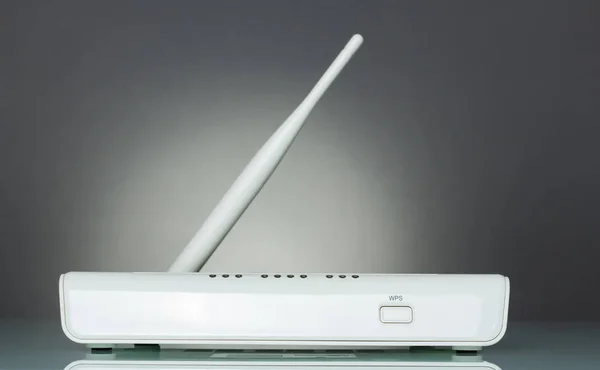 Wi-Fi router device with secure wireless setup WPS, on gray — ストック写真