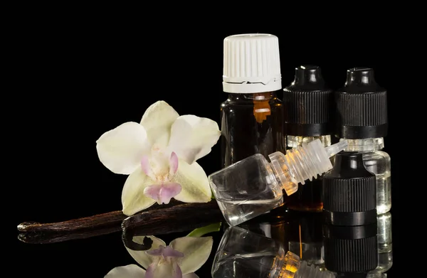 Bottles Aromatic Liquid Vaping Vanilla Pods Orchid Flower Isolated Black — Stock Photo, Image