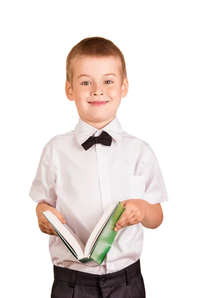 白いシャツと弓のネクタイの人形は彼の手の中に開いて本を保持しています — ストック写真