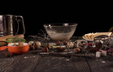 Set of products for biscuit, bowl and whisk, isolated on black background