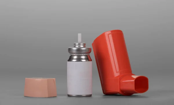 Small Pocket Inhaler Bottle Dispenser Gray Background — Stockfoto