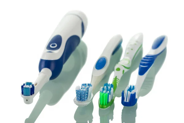 Electric Toothbrush Three Manual Brushes Different Colors Isolated White Background — Stock Photo, Image