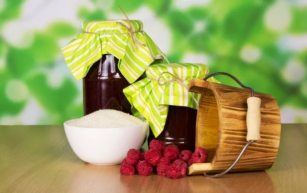 Jars Jam Bowl Sugar Handful Raspberries Bucket Abstract Green Background — Stock Photo, Image