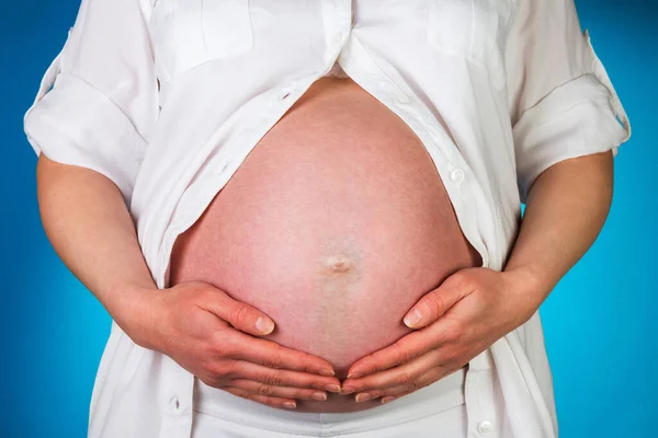 Pregnant Woman Maintains Hands Belly Blue Background — Stock Photo, Image