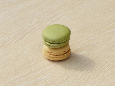 Bir ahşap zemine yığılmış Macarons.