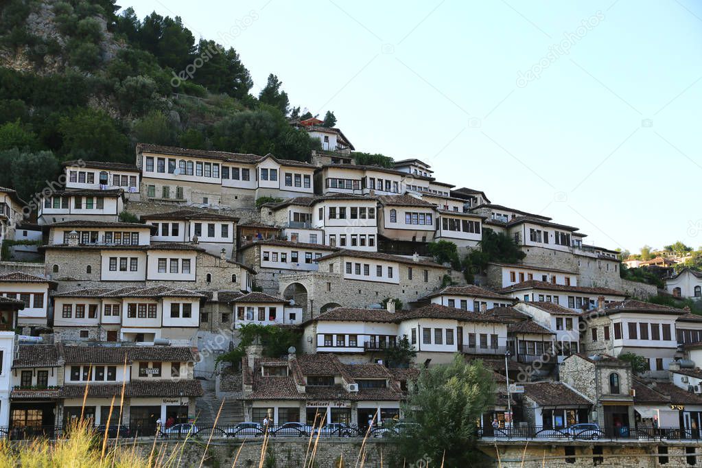 Berat, Albania -  July 2019: View of old city houses  of Berat, designated a UNESCO World Heritage. City of thousand windows.