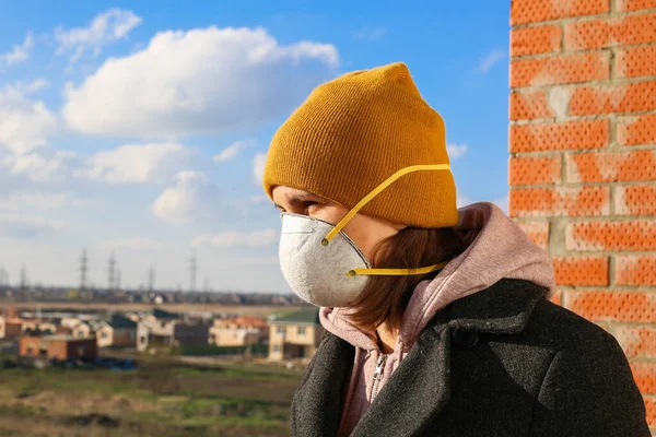Corona Virus concept. Woman wearing face mask at the street. The concept of the epidemic of the virus. Protect yourself.