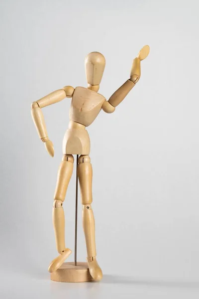 Eine Vertikale Aufnahme Einer Hölzernen Pose Puppe Mit Einer Hand — Stockfoto