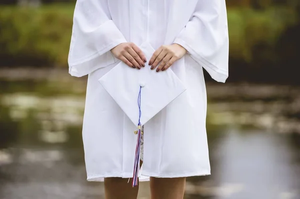 Low Angle Closeup Shot Female Graduate Wearing White Cap Gown — Stock Photo, Image