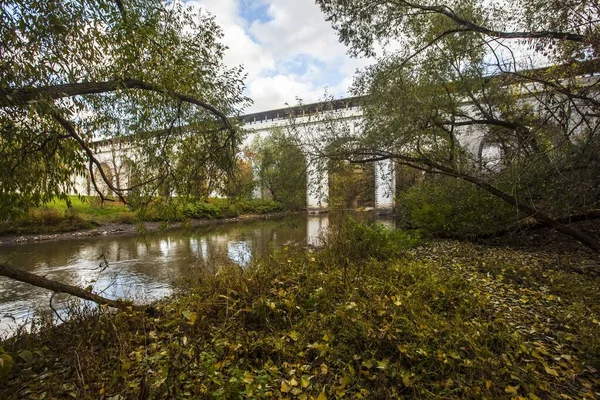 Beautiful big bridge over a river in Rostrkino park in Moscow, Russia