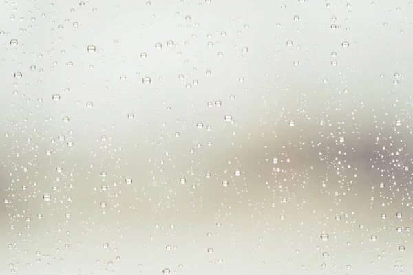 Horizontale opname van waterdauw op een glazen oppervlak — Stockfoto