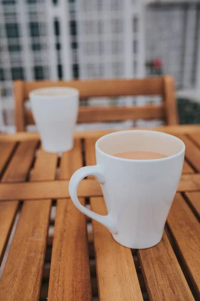 Vertical Shot Two White Mugs Coffee Wooden Table — Stock Photo, Image