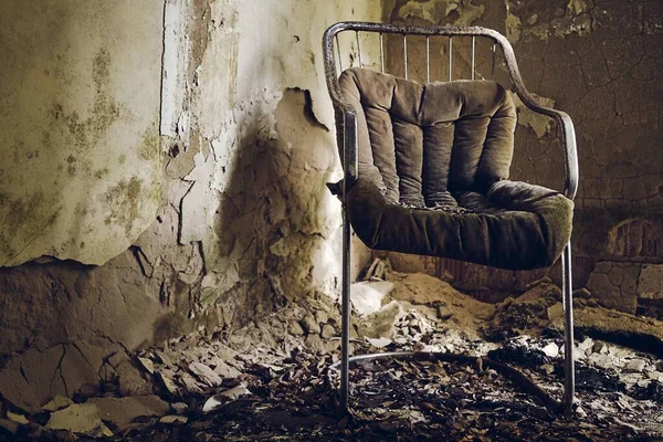 Single chair inside a ruined building with nobody - disaster after earthquake concept