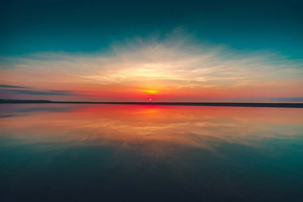 Beautiful reflection of the sunset in the ocean captured in Vrouwenpolder, Netherlands — Stock Photo, Image