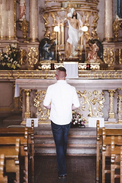 Vertical Shot Male Standing Church Praying Blurred Backgroun — Stock Photo, Image