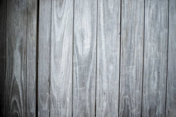 Closeup shot of a wall made of vertical gray wooden planks - perfect for cool wallpaper background — Stock Photo, Image