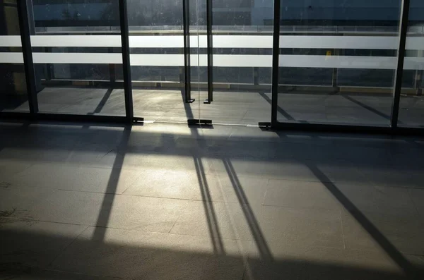 Interior of a modern business building with glass windows and white walls — Stock Photo, Image