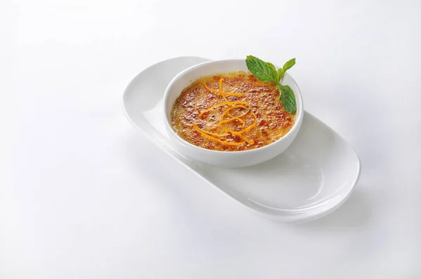 An isolated shot of a creme brulee dessert- perfect for a food blog or menu usage