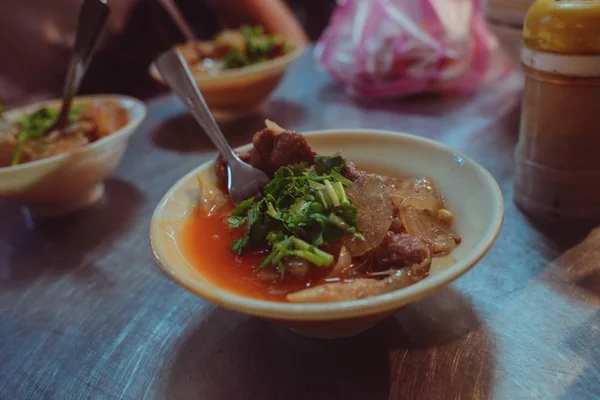 Closeup shot of a Taiwanese soup with dried fruits, meat and vegetables — Stock Photo, Image