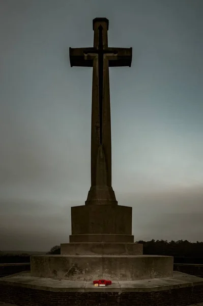 A vertical shot of a huge cross-shaped monument in the Canadian War Cemetery in Groesbeek in the Netherlands