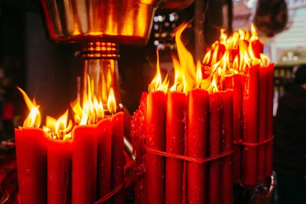 Closeup Shot Burning Red Candles Blurred Background — 스톡 사진
