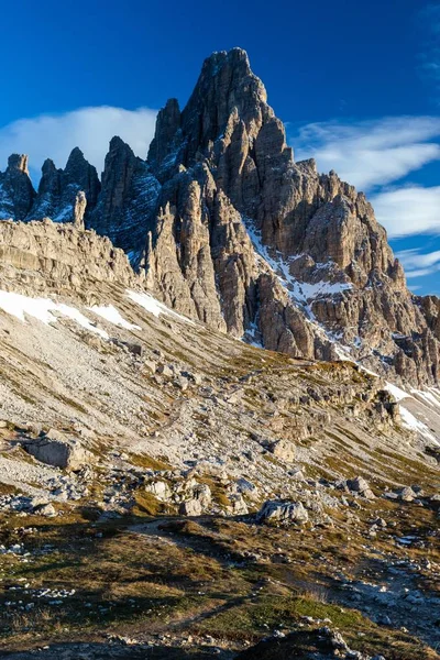 A vertical low angle shot of the Paternkofel mountain in the Italian Alps