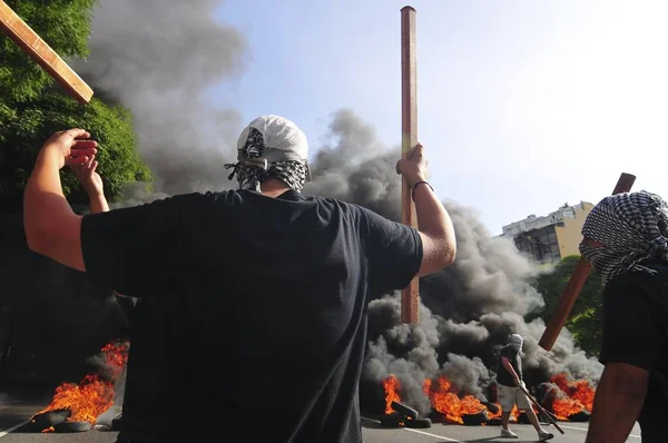 Demonstrators burn tires — стокове фото